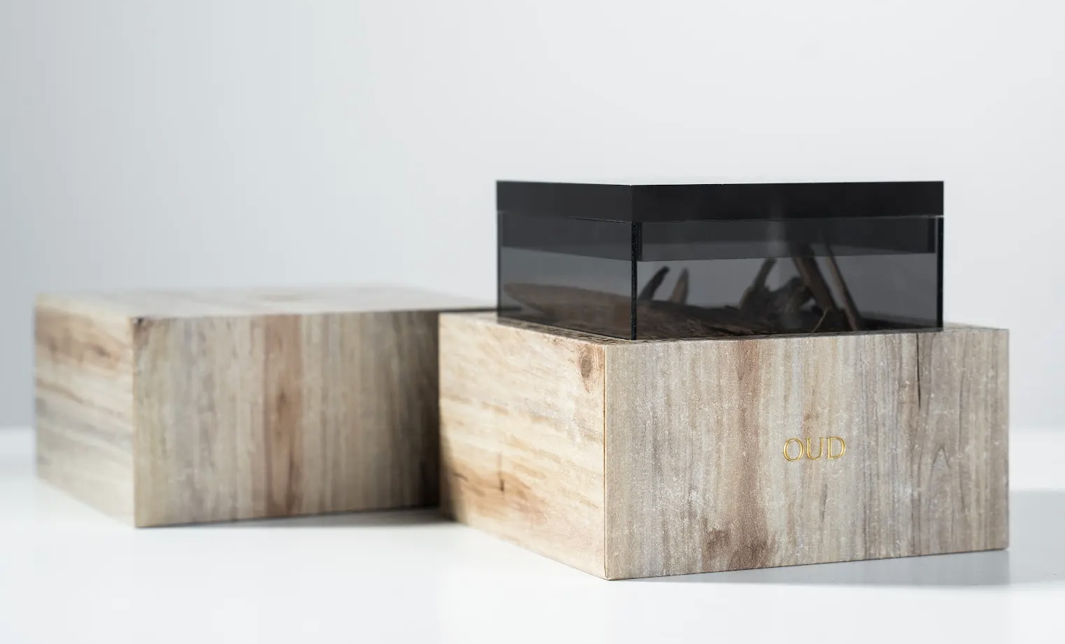 Wooden box with a black lid on a white background